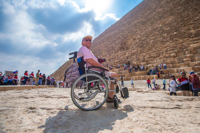 A wheelchair user explores Egypt and its pyramids.