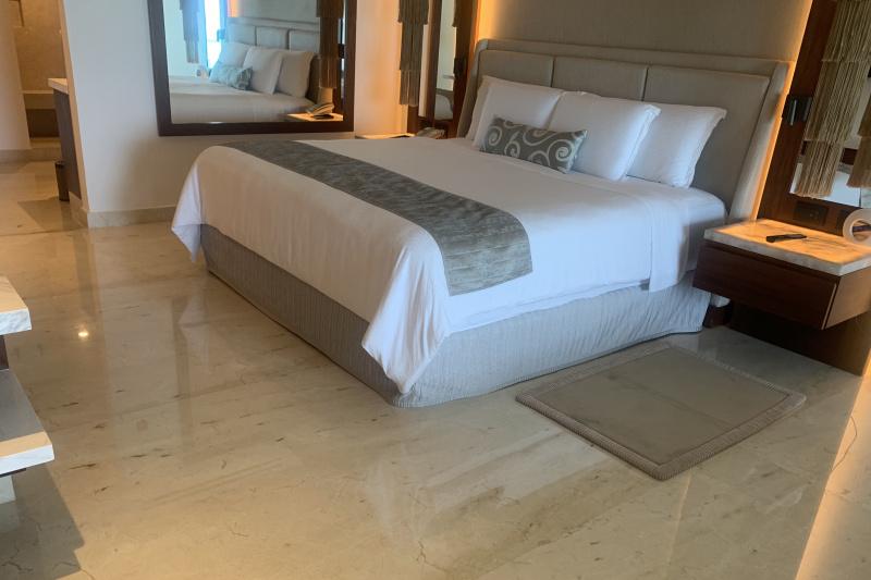 A guest room with a large double bed.
