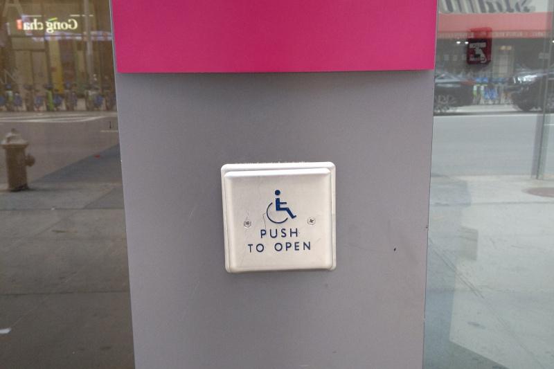 A button at the entrance to provide assistance for people with disabilities