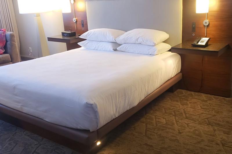 An accessible guest room with a king-sized bed and bedside tables.