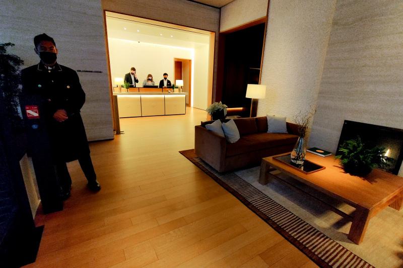 Wide lobby with wooden floors and seating area