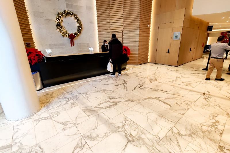 Lobby with front desk and marble floor