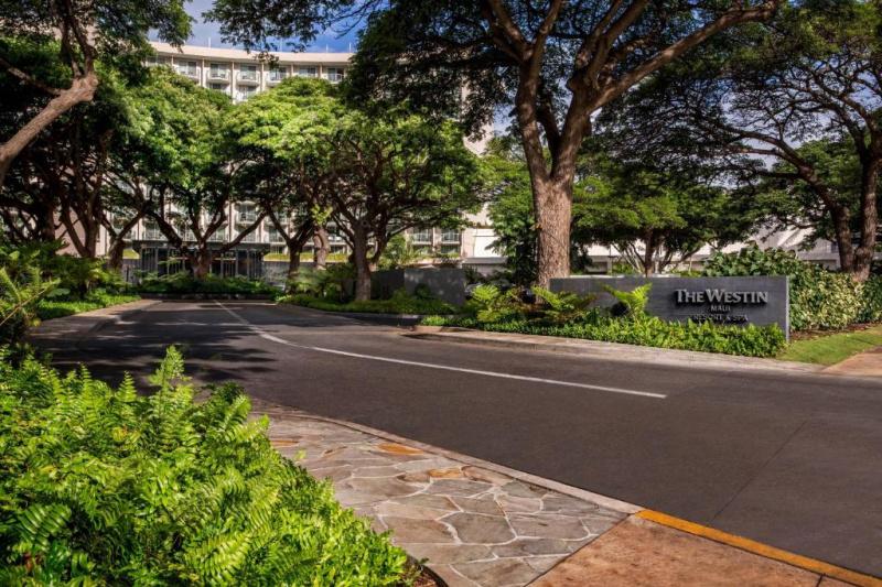 A wide, tree-lined driveway leads to The Westin Maui Resort & Spa, Ka'anapali, in Hawaii.