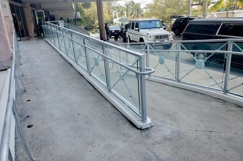 There is a shallow ramp with handrails giving access to the hotel entrance.