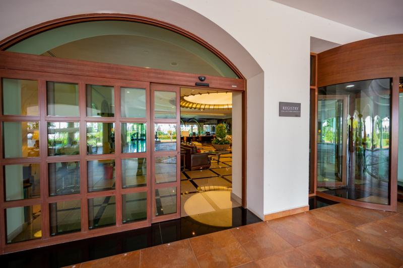 Access to the spacious lobby is through a sliding, automatic glass door.