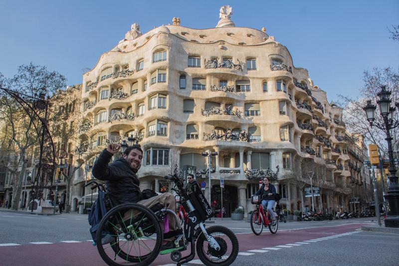 A wheelchair user explores La Pedrera Casa Milá.