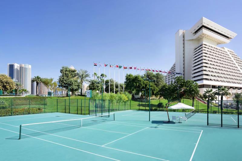 Hotel tennis courts and rolling green hills