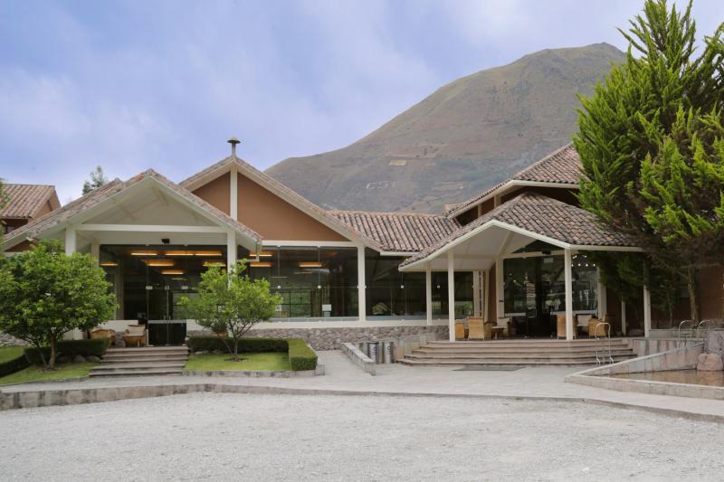 Ramped entrances of Casa Andina Premium Valle Sagrado with patio seating and mountain views