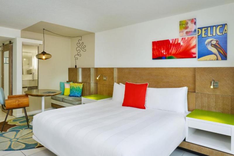A guest room with a large double bed.