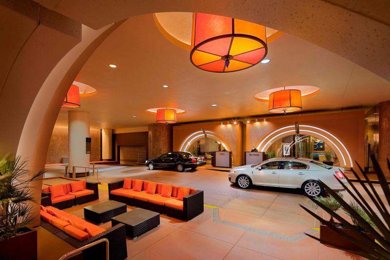 Entrance with seating area and valet for your car.