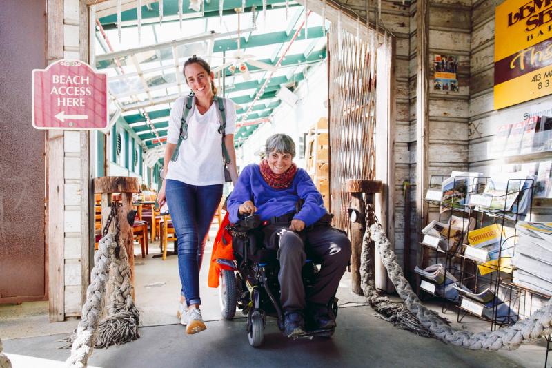 Wheel the World travelers explore Carmel's central plaza, shops, and restaurants, using accessible pathways.