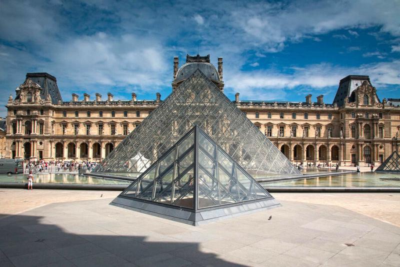 The glass pyramids in front of the Louvre museum.
